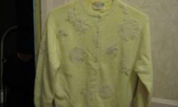 Yellow sweater size small. 70% lambswool, 30% angora, 10% nylon. Beaded on back and front.