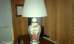 Beautiful Floral design suitable for night table. This lamp has been in my home since 1968 and is in excellent working condition. It has a three way socket, over all height is 30" from the base to the top of the shade. Shade measures H-14", top 9'wide
