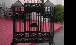 For sale is a beautiful large bird cage in cast aluminum. The cage comes apart in 3 pieces (stand, cage, top) for easy transport. The pictures speak for themselves. The cage has a small opening in the front and a large opening in the back (depending on
