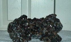 Large Crystal Cluster Garnet-Crystals embedded and growing on surface, Garnetohedra. Known as aggregates massive granular to compact. Colors:Grey and Dark Pink. This Exceptional Specimen show many Garnets running thru cluster This is a beautiful very rare