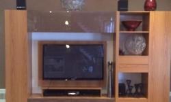 Large Wall unit to hold flat screen TV with loads of storage cabinets and drawers. A platform with wiring and brackets to hold TV's up to 53" width and 36" height (Image shown has a 46" wide TV).
Width of the unit is 120", height is 85" and depth 19". In