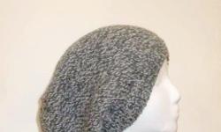 The colors in this large slouchy beanie hat are dark grey and white. The look of a tweed. A warm comfy hat for winter days. Worn by men and women. This wool beanie beret is knitted with a soft pure wool yarn. The wool beret is a medium thickness, (not