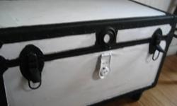 This old trunk is vintage antique & collectible for those that like the larger size trunks that can be made also into coffee table or even benches. Nicely painted in black and white, it has 4 large wheels, great to move around, especially in small places.