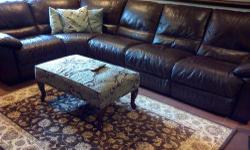 Chocolate brown Natuzzi leather sectional,one recliner, excellant condition,non smoking home,paid 5000. Remodeling serious buyers only
