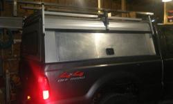 Leer Contractor Utility Cap w/ ladder rack, custom metal tray, all doors keyed and lock, $600.00. It is on a Ford F250 Super Duty short box. Please call 315-783-6716 for more info.