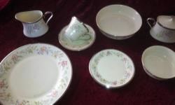 FLIRTATION Pattern Cira 1980`s This is a complete set of ivory Lenox with silver trim. No chips, cracks, & scratches. This set is in mint condition. A spring time flower pattern on every piece. Complete serving for twelve people including many extras