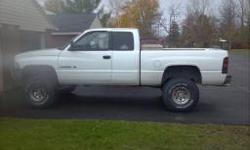 99 dodge ram 1500 ext cab 5.2 v8 with 170k mi. White in color new head liner 5" BDS suspension lift 80% left 35-12.50x15 BFG all terrain tires After market air filter flowmaster duel exhaust Runs great holds over 40psi oil pressure at idle. One rust spot