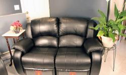 For sale is a hardly used loveseat recliner. Made out of synthetic leather, this recliner allows one or two people to recline individually.
A growing family means no more room for a love seat.
In excellent condition. Bought new, kept new in plastic