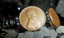 Lincoln Wheat Penny Bracelet has 7 coins in Front and has 7 inside Bracelet. Coins are Authentic and Dates in Front of Bracelet are 1951-D, 1952-D, 1953-D and 1954-D the inside dates are 1952-D. 1953-D and 1954-D. The coins are copper, extra fine, very
