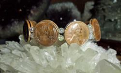 Lincoln Wheat Penny Woman?s Bracelet has 7 coins in Front and has 7 inside Bracelet. Coins are Authentic and Dates in Front of Bracelet are 1955-D, 1956-D, 1957-D and 1958-D the inside dates are 1956-D. 1957-D and 1958-D. The coins are copper, extra fine,