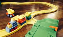 Selling my sons' Little Tikes train set, made of sturdy plastic. It's perfectly great, almost brand new. I just washed it thoroughly with hot sudsy water. It includes a 3-piece train, people, a dump truck, track, station and tunnel. The track has curved