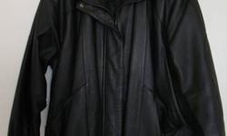 Liz Baker woman's black leather coat. Size Large (runs slightly big for size). Zippered front with snaps on the bottom and sleeves, quilted lining. Excellent condition.