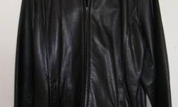 Liz Claiborne woman's black leather jacket. Size XL (runs small for size). Soft glove leather with zippered front and pockets. Excellent condition.