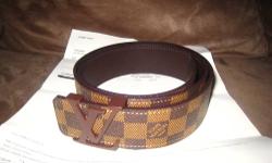 Authentic Louis Vuitton men's belt for sale made in Spain with brown damier canvas and taiga leather with LV initials logo in mint condition with damier ebene checkers, sport this Louis Vuitton men's belt with True Religion jeans and a t-shirt to keep it