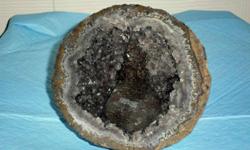 Amethyst Geode Crystals with Tonsil-This is a beautiful unique one of a kind and very rare Geode. That has a Purple tonsil in the center of the Geode and purple crystals thru-out of the Geode. This pretty specimen comes from Brazil. Size: 4 3/8? x 4 3/8?