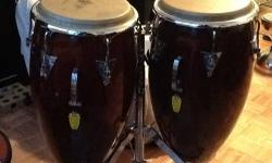 I have a Tumbadora and a Conga For Sale. They are a beautiful Wine Red finish w/ minor nicks. The heads are perfect. They're really in Excellent Condition. I'm throwing in the Heavy Duty Chrome Stand for Free. I'm in NYC (East Midtown Manhattan). Asking