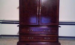 INCLUDES:
1 Mahogany Armoire Jewelry Box
FEATURES:
The unit has two thick double doors one which contains a storage area perfect for rings & bracelets and the other with a long display mirror. It also displays a center mirror. Lined with soft cream felt,