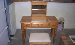 Make-up table has two side drawers, center opens and has mirror on inside of top. Good condition. Cash and carry please.