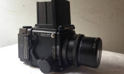 Mamiya RZ PRO II camera system. Includes Camera body, Waist level Finder, 150 mm Lens, 90 mm Lens, both with w rubber lens shades, AE FE701 prism Finder with box, 2 120 film magazines, Polaroid Back looks wild works great, Bellows are a bit creased but no