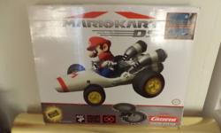 THIS IS A BATTERY OPERATED SLOT CAR SET.THIS IS A COMPLETE SET ALL IN EXCELLENT LIKE NEW SET USED ONCE.THIS BOX HAS SOME WEAR.THIS IS FOR AGES 4 & UP.THIS IS A MUST FOR ANY MARIO KART FAN.