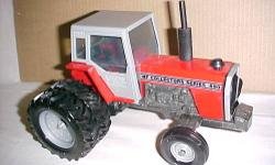 MASSEY SPECIAL EDITION COLLECTOR MODEL, ERTL #1124TA, MF699 WITH CAB, DUAL REAR WHEELS, 1985, NEW IN BOX. TERMS: EITHER BANK CHECK (CHECK FROM BANK MADE OUT TO ME OR POSTAL MONEY ORDER, PRICE INCLUDES SHIPPING, AS SOON AS MONEY CLEARS TRACTOR WILL BE