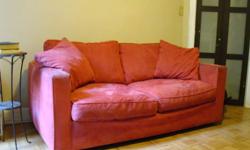 This out of production sofa can accommodate 3 people very comfortably. The cushions are made of down and the covers are all washable. Remove the cushions to reveal a full size bed.
Minor wear on the ends but in great condition. This sturdy couch can