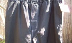 Men's Size 'BIG' Pants
Draw String Waist
Elastic at ankle with zipper
Pants Do Not have a zipper fly
3 Pockets
Black with Silver Stripe on Side
100% Nylon Shell
65% Polyester & 35% Cotton Lining
Machine Washable
New and Never Worn with Tag