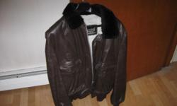 Here's a brown leather jacket by "Cooper" that's made in the USA. I believe this is the same company that made famous bomber jackets for the military. It's genuine leather and in excellent condition. It was worn a few times if that. Still smells brand