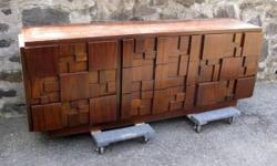 Here?s a cubist inspired nine drawer dresser made by Lane Furniture Co. in the 1960?s. Made of walnut. This beautifully scaled piece needs some TLC, but structurally sound and functions flawlessly. Worth thousands if refinished.
Dimensions: 30" H x 78" W
