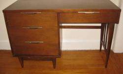 Beautiful mid-century modern walnut desk from Kent Coffey's Tableau series. Made in the USA with Scandinavian design elements. Smaller scale desk with lots of storage and a generous amount of surface space to work with. Nice inset drawer pulls. Overall in