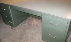 Metal tanker desk from the 1950s or 60s. Double pedestal, tan color with a Brown top. Will last forever.
Appox dimensions: 30D x 60W x 29H
Estimated weight: 200 lbs
Cash or PayPal. Curbside delivery can be arranged for a fee.