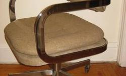Mid-century Mod styled chairs. Made by Patrician Furniture Company. The chrome and the curves make a real statement. Very comfortable and wide. Rolls smoothly. Swivels and rocks. Upholstery needs some cleaning or could be replaced. Would look great in