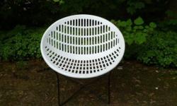 This is a very cool outdoor chair called the Solair Chair designed by Fabiano and Panzini in 1972. It's perfect for either indoors or outdoors in your garden or patio. This chair has a white plastic seat on a metal frame, and it's about 28 1/2" wide from