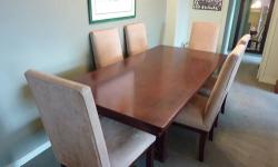 PERFECT CONDITION!
Chocolate brown Mission-style table, 6ft. long x 3ft. wide.
Set includes six beige ultrasuede super-comfortable chairs, with matching wood legs. Also in perfect condition.