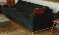 This beautiful, low profile, deep sofa is the ultimate spot to lounge or take a nap. The wide arms combine with the clean lines of the contemporary design to create a strong, inviting presence in your room. In really good condition, except for some