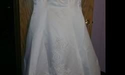 Beautiful size 20 short sleeved Wedding Gown. Beaded upper, back and train. Beaded Lace Sleeves. This dress is unaltered and never worn. Great Gown for any Season! Paid $1000 asking $150 OR best offer. Please contact me with any questions you may have.