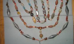 Necklaces $20 each, any two $35, mix and match with coral and marble necklaces in separate ads.
Carnelians with coral, jasper, various silvery metal elements 24"
Agate elongated beads with gilded metal beaded elements, mixed with stone, carnelean, jasper,