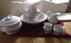 Late 1800's set includes Wash basin, Large water pitcher chamber pot, shaving bowl, toothbrush holder, small pitcher. Made by KT&K Co.
small crack inside wash basin
