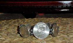 This is a Beautiful New Money Coin Bracelet has 7 coins in Front and has 7 inside Bracelet #1. Coins are Authentic and Dates in Front of Bracelet are 2014-D Kennedy Half Dollar, 2009-P Northern Maine Islands Quarter, 2004-P Michigan Quarter, 1995-P