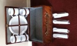 New, and never used, old fashioned picnic basket complete with service for 4.
Includes, all plastic cups,plates and utensils(knife, fork and spoon).
Have fun packing a real old fashion picnic basket the next time you go to the park or beach.
Plenty of
