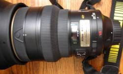 You are looking at one of my favorite lenses, the Nikon Nikkor AF-S 200mm f/2 VR I (Version 1) G lens for Nikon DSLRs. This is one of the most manageable of the super telephoto series, relatively lightweight and small sized comparing to the other big