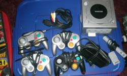 I have a Nintendo game-cube with all the connections as well as four remote controls, memory card microphone and nine games....all in perfect condition.
