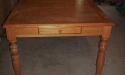 42"x54" oak dining table with 18" leaf. No chairs. Good condition