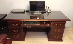 Mahogany color,solid wood office desk with plenty drawers.
In good condition.It comes with protective glass.
File cabinets, office chairs are also for sale as part of moving sale.