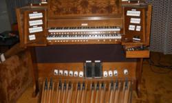Church organ with full AGO pedal board, also suitable for the home. Single owner, smoke-free environment, excellent physical and operating condition.
56"W x 49"H (55" w/ 12" music on rack) x 46"D (27-1/4" w/o pedal board)
Through an LCD control center