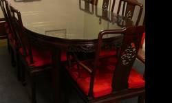 Beautiful oriental rosewood dining table and eight chairs. Table has glasstop. Excellent condition. Rarely used for dinner and always covered with tablecloth.
Cash and pickup only.