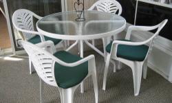 40" round, 4 white stackable chairs & 4 green chair pads - Always used in screened room - VG condition MUST SELL - MOVING!