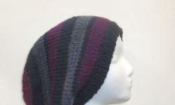 This hand knitted oversized hat colors are navy blue, lavender, purple. A warm hat. The slouch hat is made with acrylic 80% and wool 20%yarns. Very stretchy, will fit any head, stretches out to 31 inches around. The measurements are lying flat on a table,