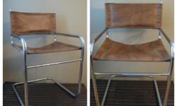 I have 2 very modern chromed tubular steel frame chairs. Seat and back are leather or leather like upholstery. Cantilever design. Very sturdy. Very stylish. Chrome is in excellent condition. Manufacturer unknown.
To see my other listings, go to