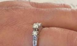 White gold, size8 , about 1/2 kt. total diamond ... Bought at Kay's jewelers for $699.00 +tax and warranty... I will give u the name its under so u can keep up on the diamond inspection every 6months. Listed for $450.00 or make a reasonable offer!!